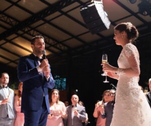 Bride and groom giving a speech at wedding reception