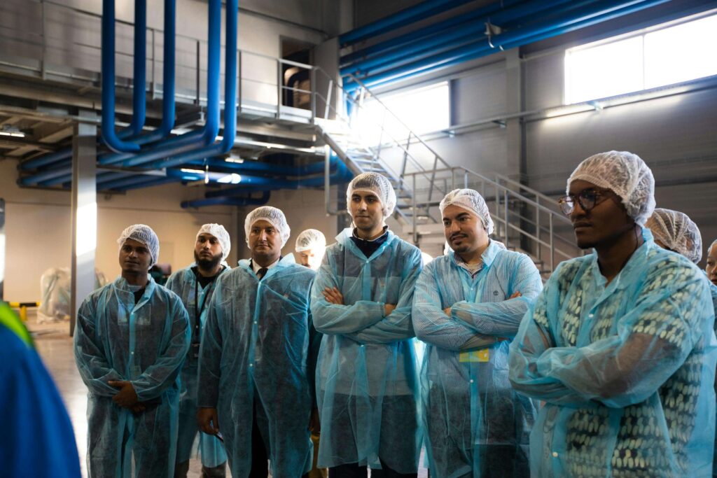 Group of factory workers on a tour