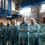 Group of factory workers on a tour